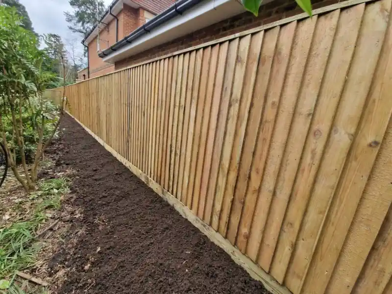 A strong and secure feather edge fence surrounding a garden