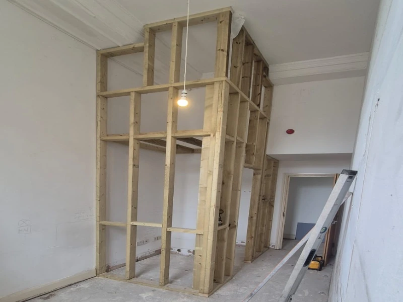 The internal timber frame and stud walls of a new build