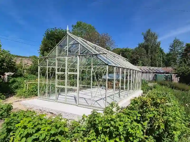 A freshly laid concrete base for a garden greenhouse