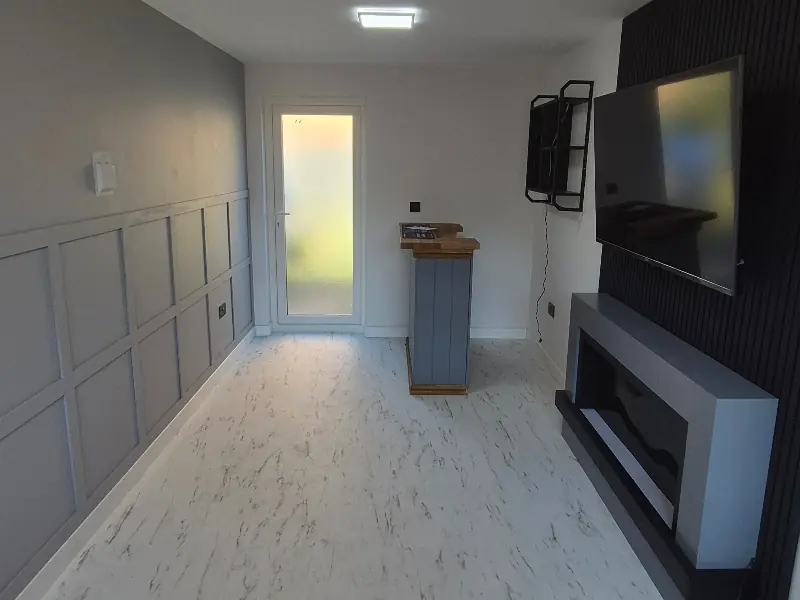 The interior of a garage converted into a living space in Newport