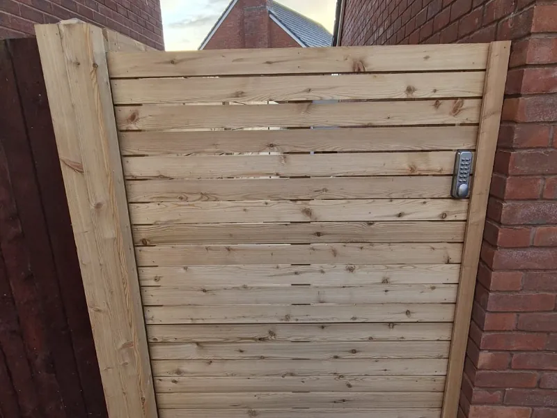 Bespoke Larch slatted gate featuring a secure digital keypad lock